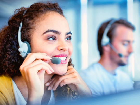 GLS call center employee smiling