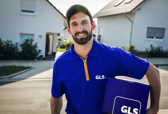 GLS parcel delivery driver standing on a street