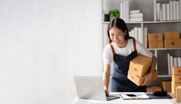 woman sitting in a chair with parcels