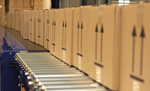 Packages neatly arranged on an automated conveyor