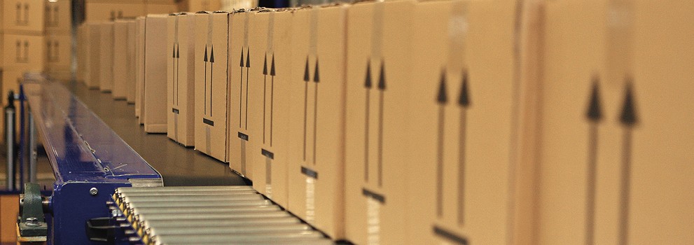 Packages neatly arranged on an automated conveyor