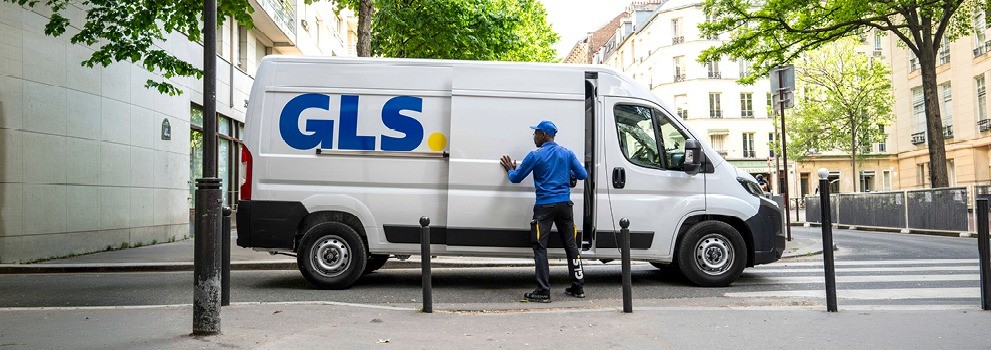 GLS delivery van with courier opening the side door during an urban parcel delivery route.