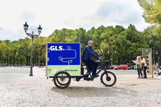 GLS employee driving a ebike in the city