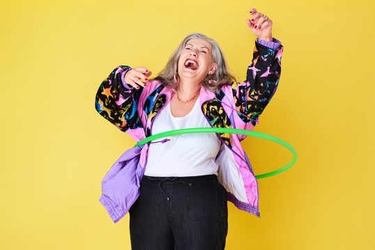 Happy woman on GLS yellow background