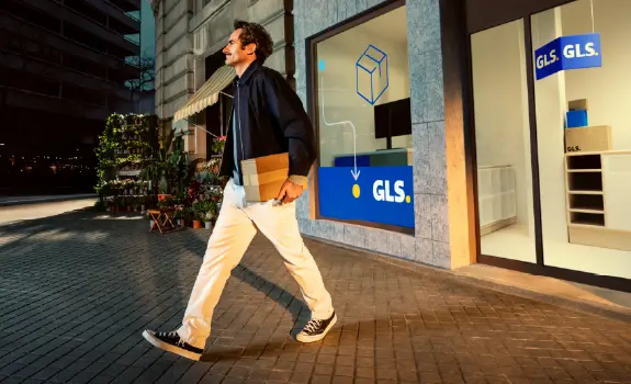 Man walking out of Parcel Shop