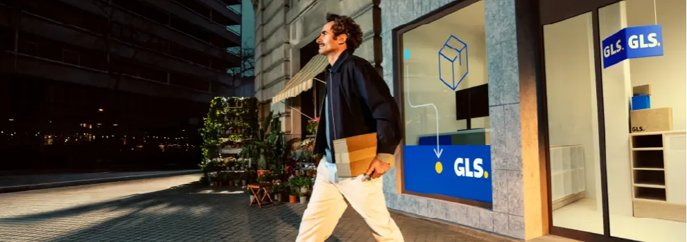 Man walking out of Parcel Shop