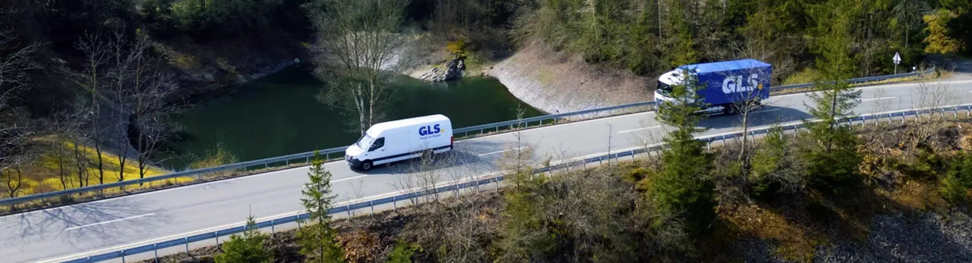 delivery van and truck on road 