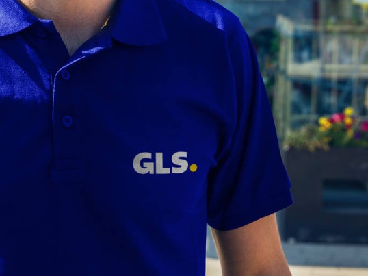  GLS Parcel Shop employee in front of the store