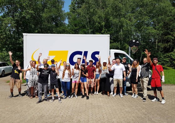 Crowd gathered in front of GLS parcel delivery van for Parcel Day 2019